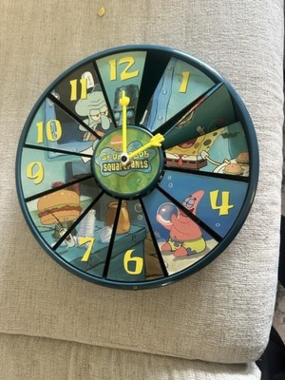 This is a vintage Nickelodeon SpongeBob SquarePants Spin-O-Clock wall clock 2002